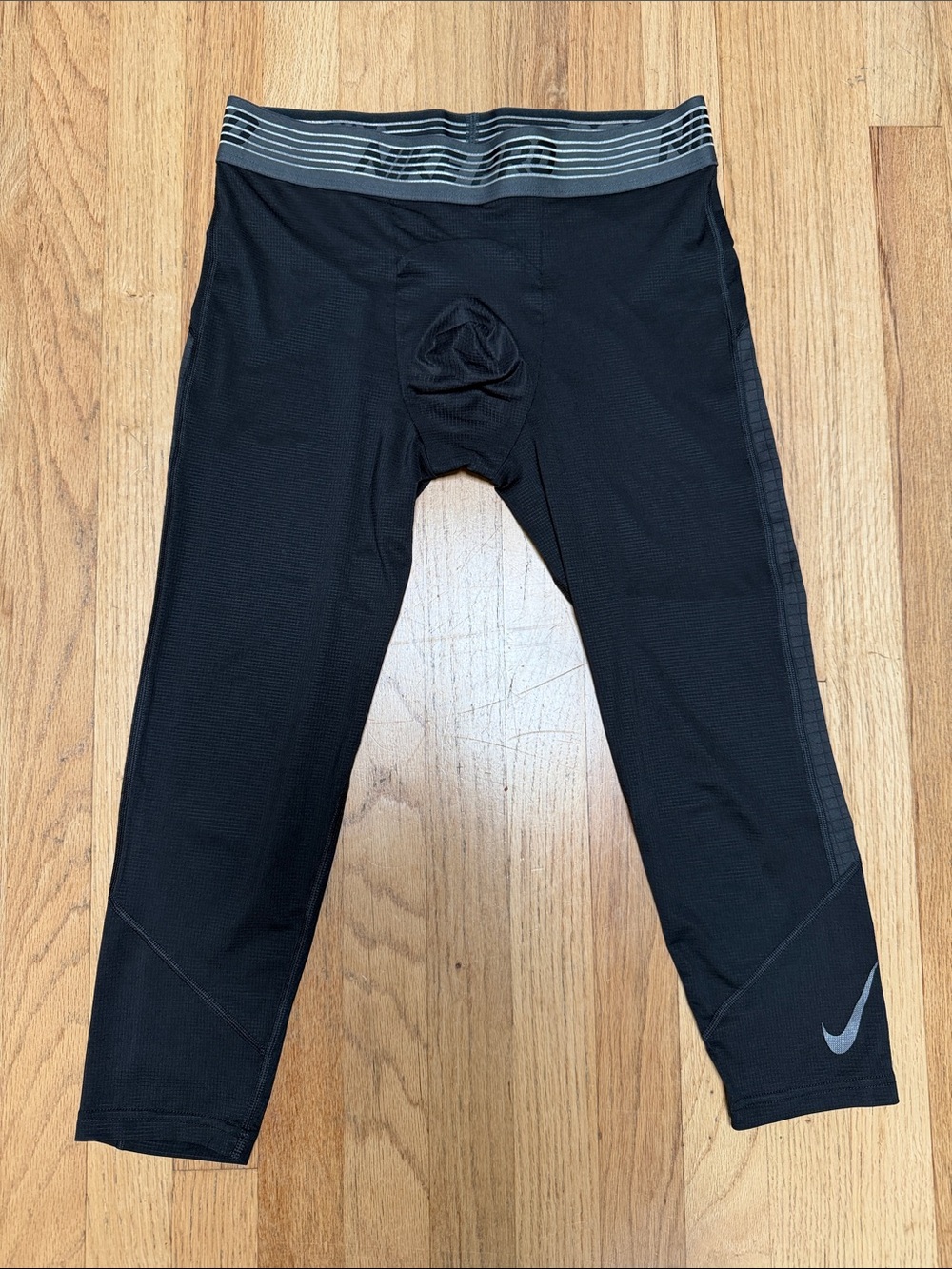Nike Black 3/4 Athletic Tights with Gray Waistband and Reflective Swoosh